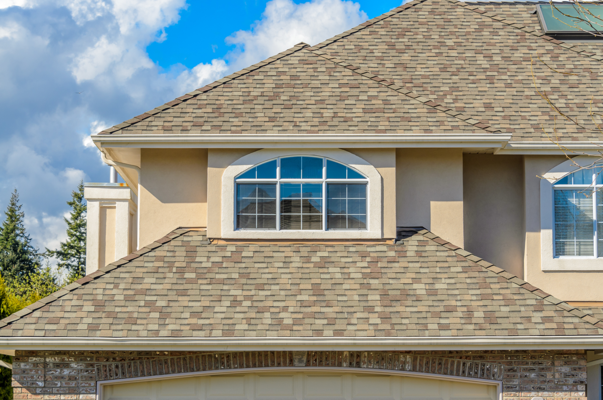 Brown asphalt shingle roof professionally installed by Fox Valley Exterior Home Services.